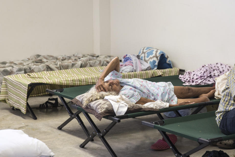 A resident lay on a cot inside a shelter after being evacuated from a home near the damaged Guajataca Dam after Hurricane Maria in Isabella, Puerto Rico, on Saturday, Sept. 23, 2017. Amid their struggles to recover fromï¿½Hurricaneï¿½Maria, some Puerto Rico residents found it befuddling that President Donald Trump fired off a number of Twitter rants about professional athletes on Saturday -- yet made no mention of their dire situation. Photographer: Alex Wroblewski/Bloomberg via Getty Images