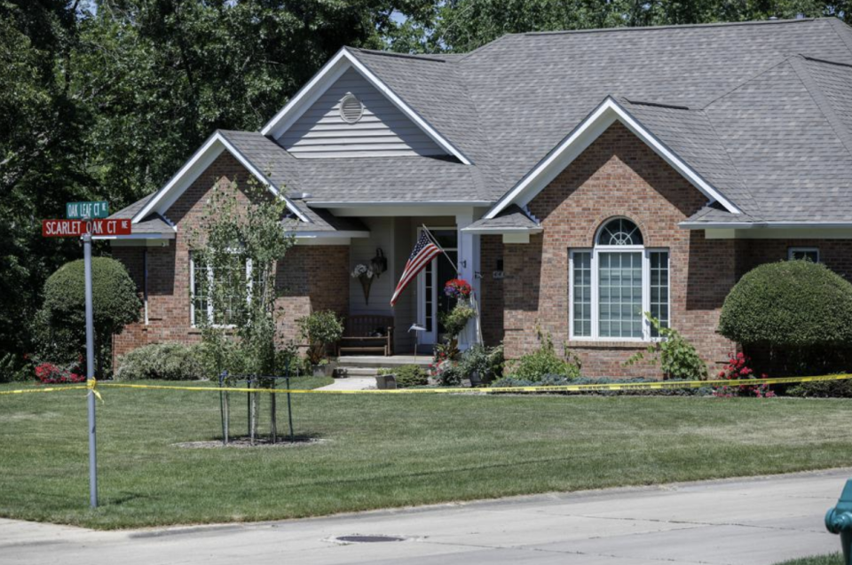 The family's home is sealed off with caution tape on Oak Leaf Court NE in Cedar Rapids, Iowa. Source: Rebecca F. Miller/The Gazette via AP
