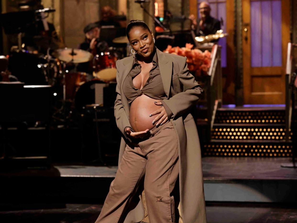 Keke Palmer shows baby bump during a monologue on "Saturday Night Live" on December 3, 2022.