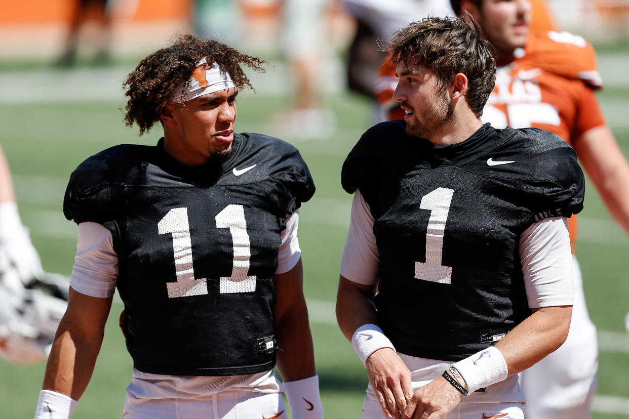 AUSTIN, TEXAS - APRIL 24: Casey Thompson #11 of the Texas Longhorns talks with Hudson Card #1 after the Texas Football Orange-White Spring Game at Darrell K Royal-Texas Memorial Stadium on April 24, 2021 in Austin, Texas. (Photo by Tim Warner/Getty Images)