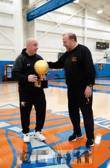 Bounce Out the Stigma founder Mike Simmel receives Jr. Knicks Coach of the Year trophy from New York Knicks head coach Tom Thibodeau.