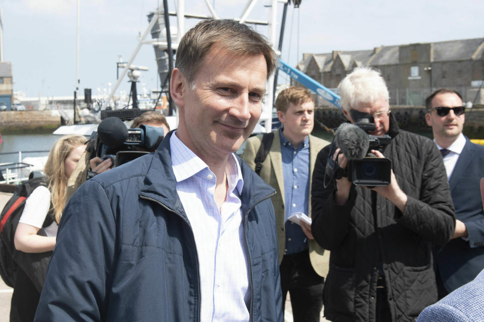 Conservative Party leadership candidate Jeremy Hunt meets with local fishermen in Peterhead in Aberdeenshire, Scotland, Sunday June 23, 2019. (Michal Wachucik/PA via AP)