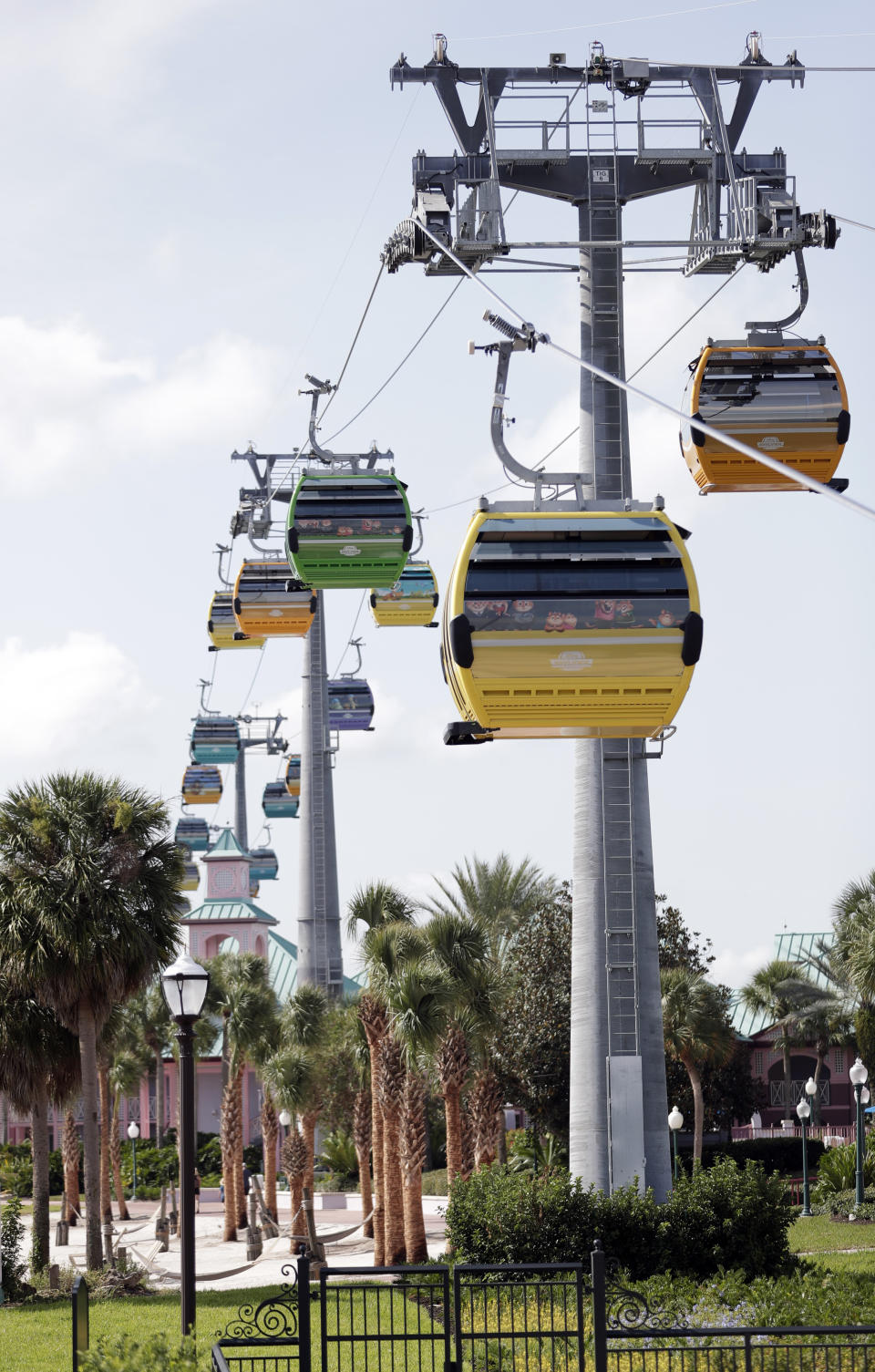 Gondolas move to various locations at Walt Disney World on the Disney Skyliner aerial tram, Friday, Sept. 27, 2019, in Lake Buena Vista, Fla. The Disney Skyliner gondolas opening to visitors on Sunday are the latest addition to one of the largest private transportation systems in the U.S. (AP Photo/John Raoux)