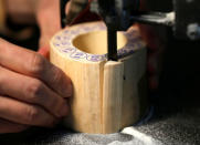 Round-sliced ivory is cut for making 'hanko' or carved name seals at a factory in Tokyo, Japan November 28, 2016. Picture taken November 28, 2016. REUTERS/Issei Kato