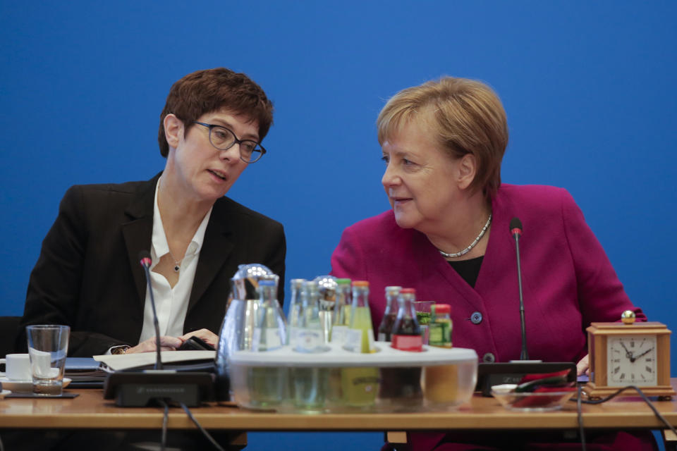 German Christian Democratic Party, CDU, chairwoman and Chancellor Angela Merkel, right, talks with Secretary General Annegret Kramp-Karrenbauer prior to a party's leaders meeting at the headquarters the in Berlin, Germany, Monday, Oct. 29, 2018. (AP Photo/Markus Schreiber)