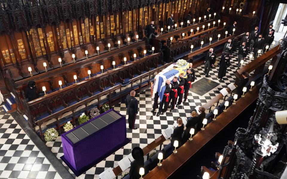 Queen Elizabeth II watches as pallbearers carry the coffin of the Duke of Edinburgh - Dominic Lipinski/PA Wire