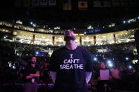 FILE - In this Dec. 9, 2014, file photo, Los Angeles Lakers' Carlos Boozer, wearing a T-shirt reading ""I Can't Breathe" stands before team introductions for an NBA basketball game against the Sacramento Kings in Los Angeles. Eric Garner uttered those words six years ago, locked in a police chokehold. It became a rallying cry after his death for demonstrators across the country who protested the killings of African Americans by police. Until this week. George Floyd uttered the exact same words, while handcuffed and pinned at the neck under the knee of a white police officer, galvanizing the movement anew and prompting mass protests around the country. (AP Photo/Jae C. Hong, File)