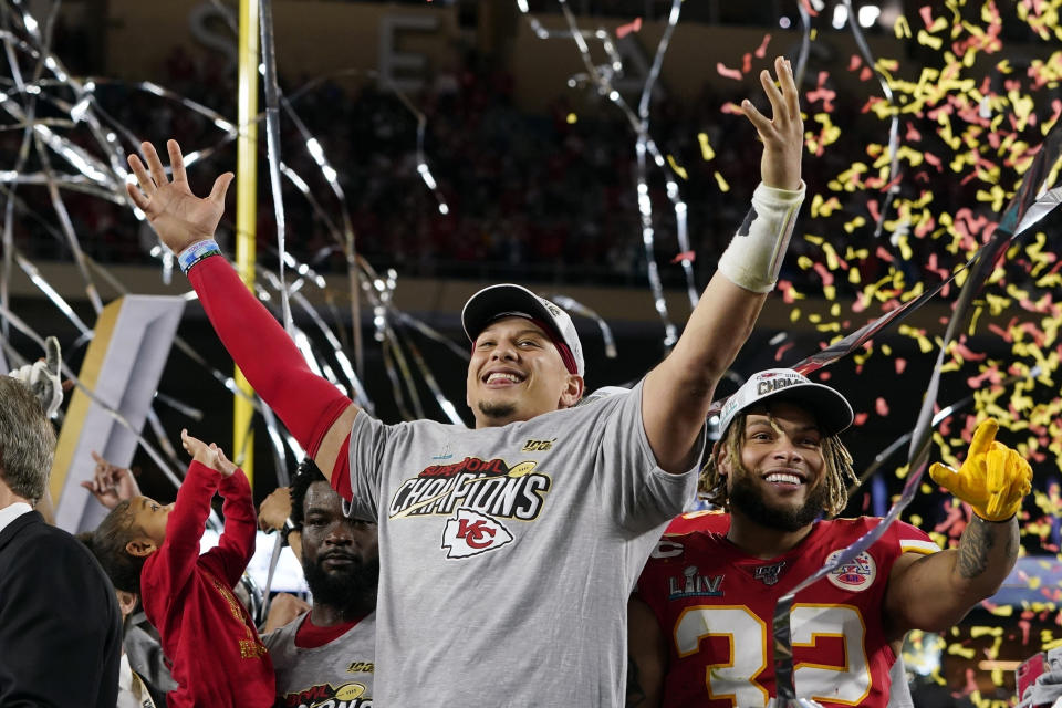 FILE - In this Feb. 2, 2020, file photo, Kansas City Chiefs' Patrick Mahomes, left, and Tyrann Mathieu celebrate after defeating the San Francisco 49ers in the NFL Super Bowl 54 football game in Miami Gardens, Fla. Teams could afford recent contracts like the megabucks given to Mahomes and Joey Bosa under normal circumstances. Because of economic effects from the pandemic, future player deals and a salary cap that will be adjusted due to some monetary setbacks, upcoming free agents might find the marketplace tighter. (AP Photo/David J. Phillip, File)