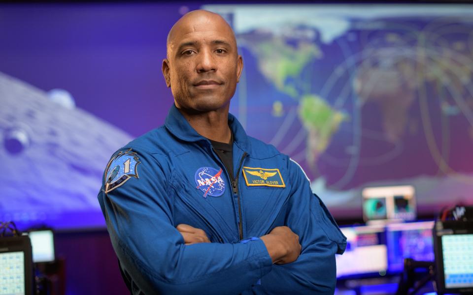 NASA astronaut Victor Glover poses for a portrait in September 2020 in the Blue Flight Control Room at NASA’s Johnson Space Center in Houston.