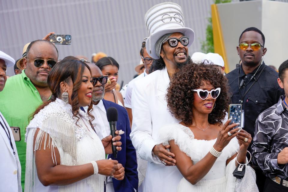 Hamilton County Commissioner Alicia Reece, William “Bootsy” Collins and Patti Collins interact with an augmented reality exhibit at the unveiling of the Black Music Walk of Fame on Saturday