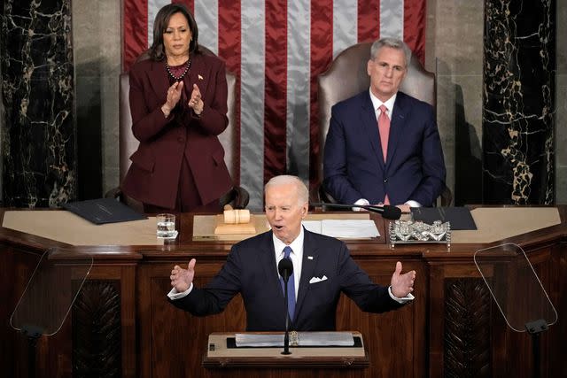 Drew Angerer/Getty Then-House Speaker Kevin McCarthy sits beside Vice President Kamala Harris while President Joe Biden delivers his 2023 State of the Union address