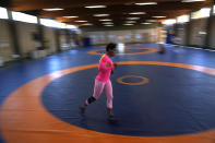 Guinean wrestler Fatoumata Yarie Camara runs at the end of her morning training session at the Ostia's Olympic training center in Ostia, near Rome, Monday, July 5, 2021. Coach Vincent Aka _ a former Olympian himself, managed to secure money for a two-week June training camp in Italy. A West African wrestler's dream of competing in the Olympics has come down to a plane ticket. Fatoumata Yarie Camara is the only Guinean athlete to qualify for these Games. She was ready for Tokyo, but confusion over travel reigned for weeks. The 25-year-old and her family can't afford it. Guinean officials promised a ticket, but at the last minute announced a withdrawal from the Olympics over COVID-19 concerns. Under international pressure, Guinea reversed its decision. (AP Photo/Alessandra Tarantino)