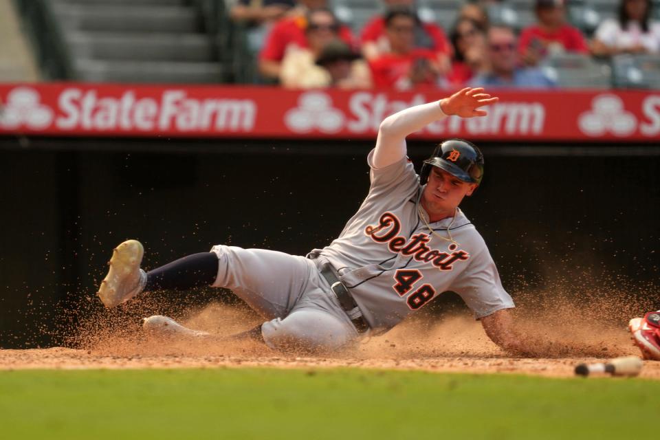 Tigers left fielder Kerry Carpenter reaches home plate against Angels catcher Matt Thaiss to score in the seventh inning of the Tigers' 5-4 win on Wednesday, Sept. 7, 2022, in Anaheim, California.