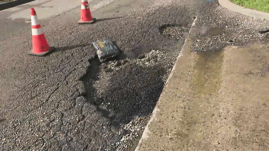 Alex De La Rosa fills a pothole in Compton on March 7, 2024.