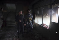 FILE- in this Wednesday, March 25, 2020, photo, security personnel inspect a Sikh house of worship in the aftermath of a deadly attack in Kabul, Afghanistan. Pakistan asked neighbor Afghanistan to extradite Aslam Farooqi, a leader of the local Islamic State affiliate, who was arrested in an Afghan intelligence operation in southern Afghanistan earlier this month. (AP Photo/Rahmat Gul, file)