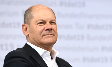 FILE PHOTO: German Vice Chancellor and Finance Minister Olaf Scholz speaks at his ministry in Berlin