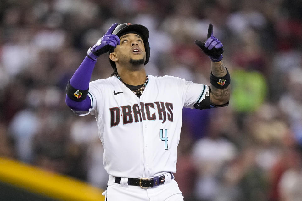 Arizona Diamondbacks' Ketel Marte celebrates after a double against the Philadelphia Phillies during the third inning in Game 3 of the baseball NL Championship Series in Phoenix, Thursday, Oct. 19, 2023. (AP Photo/Brynn Anderson)