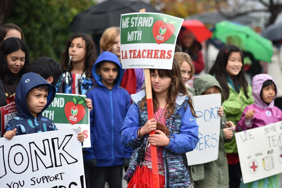 Some students are walking the picket lines with their teachers. (Photo: ROBYN BECK via Getty Images)