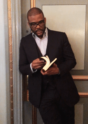 GIF of Tyler Perry flipping through a book