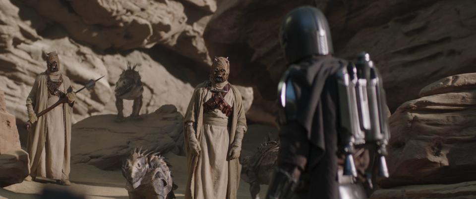 Tusken Raiders talk to the Mandalorian (Pedro Pascal) in the season premiere of "The Mandalorian."