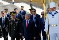 Turkey's Prime Minister Binali Yildirim (C), flanked by Chief of Staff General Hulusi Akar (front L), Defense Minister Fikri Isik (rear R) and the country's top generals, leaves Anitkabir, the mausoleum of modern Turkey's founder Mustafa Kemal Ataturk, after a wreath-laying ceremony ahead of a High Military Council meeting in Ankara, Turkey, July 28, 2016. REUTERS/Umit Bektas