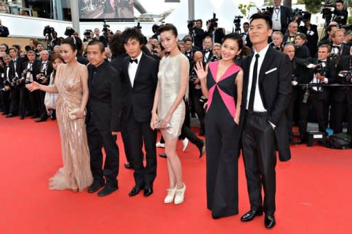 The cast of the film "Mystery" in competiton in the Un Certain Regard selection (from L) Chinese actress Hao Lei, Chinese director Lou Ye, Chinese actor Qin Hao, Chinese actress Qi Xi, Chinese actress Chang Fangyuan and Chinese actor Zhu Yawen arrive for the screening of "De Rouille et D'Os" (Rust and Bone) presented in competition at the 65th Cannes film festival in Cannes