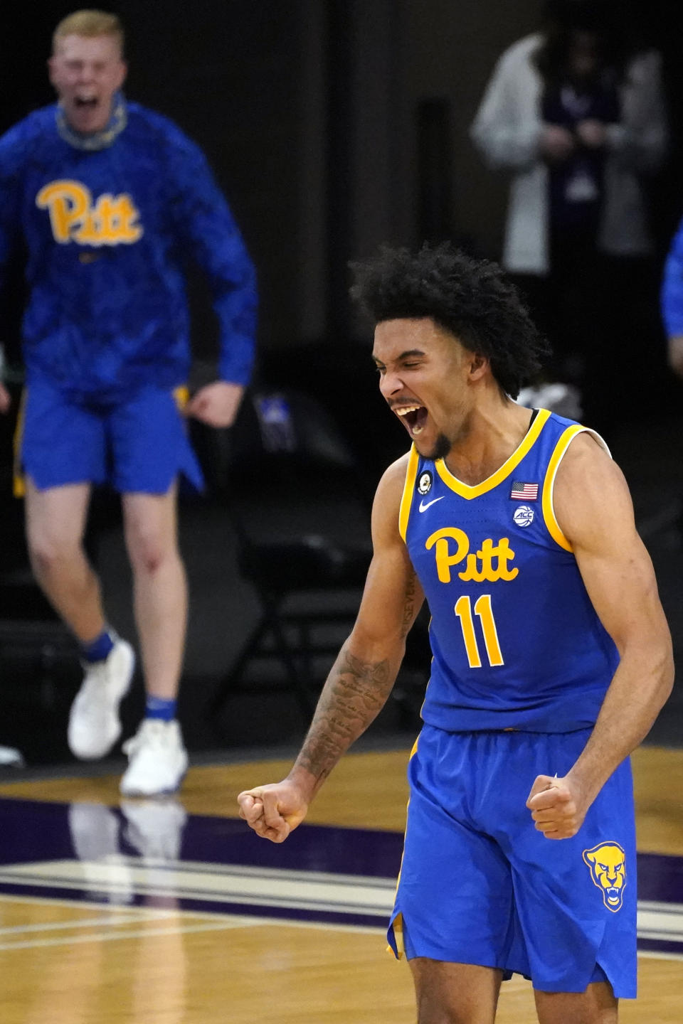 Pittsburgh guard/forward Justin Champagnie (11) reacts after scoring a basket against Northwestern during the second half of an NCAA college basketball game in Evanston, Ill., Wednesday, Dec. 9, 2020. Pittsburgh won 71-70. (AP Photo/Nam Y. Huh)