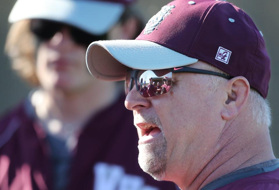 Woodridge coach Dennis Dever talks to his players before the game against Streetsboro at Streetsboro High School on Monday, April 15, 2024 in Streetsboro.