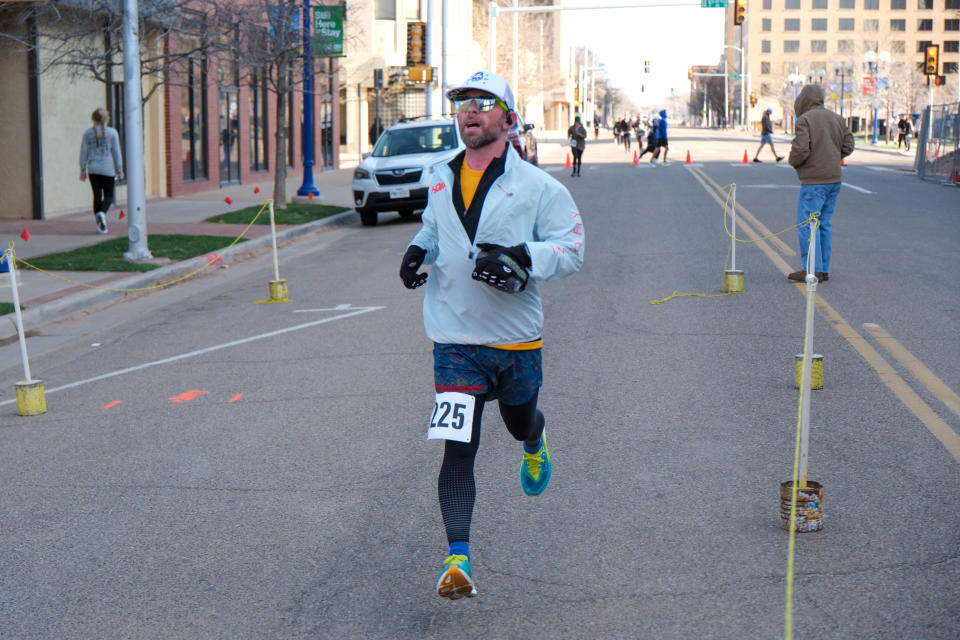 A runner approaches the  finish line Saturday in the 2023 Center City Mural Run in downtown Amarillo.