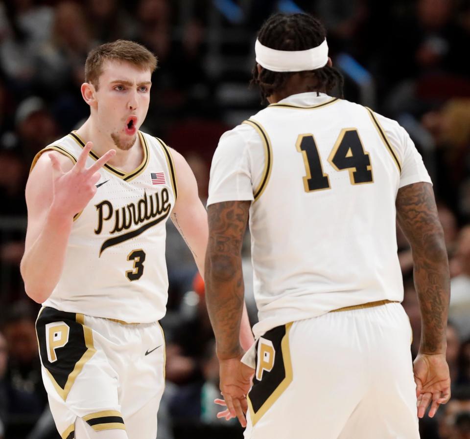 Purdue Boilermakers guard Braden Smith (3) celebrates after Purdue Boilermakers guard David Jenkins Jr. (14) scores during the Big Ten Men’s Basketball Tournament Championship game against the Penn State Nittany Lions, Sunday, March 12, 2023, at United Center in Chicago. Purdue won 67-65.