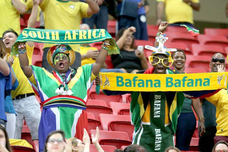 <p>South Africa fans cheer for their team during a group A match of the men’s Olympic football tournament between South Africa and Denmark at the National Stadium, in Brasilia, Brazil, Sunday, Aug. 7, 2016. (AP Photo/Eraldo Peres) </p>