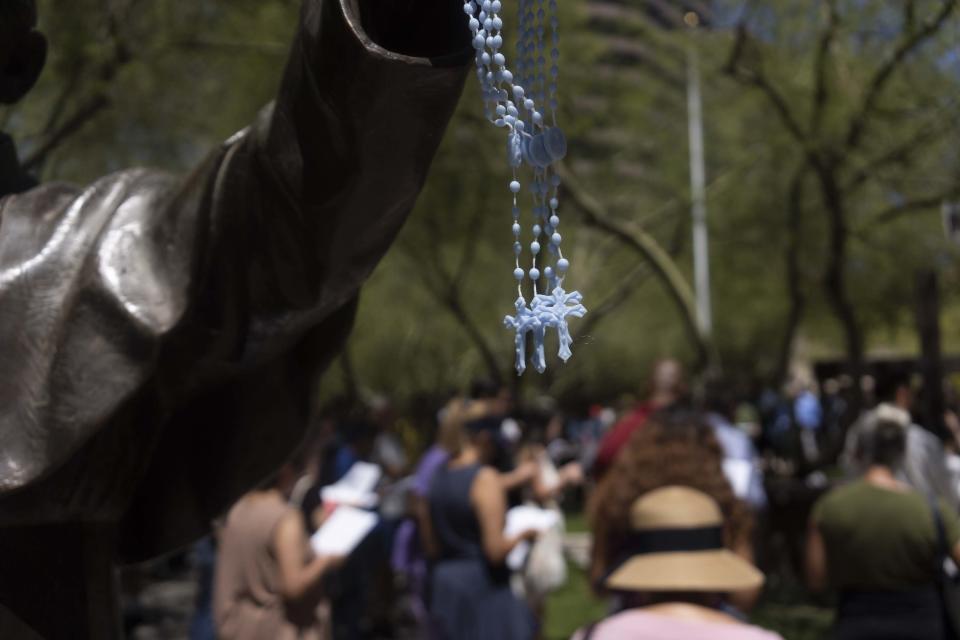 Worshipers attend Good Friday services at St. Mary's Basilica in Phoenix.