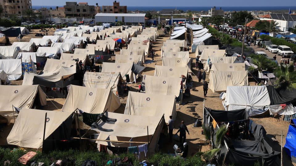 Tents for Palestinians seeking refuge are set up on the grounds of a United Nations Relief and Works Agency for Palestine Refugees (UNRWA) center in Khan Younis in the southern Gaza Strip on October 19. - Mahmud Hams/AFP/Getty Images