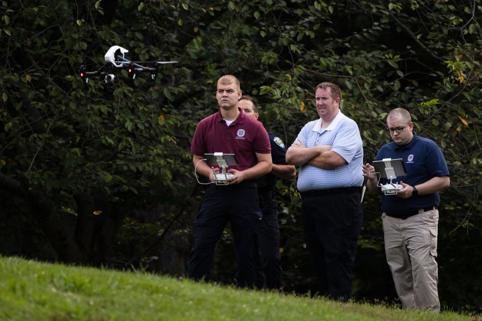 Investigators launch a drone at scene of a small plane crash in a residential neighborhood in Upper Moreland, Pa., Thursday, Aug. 8, 2019.