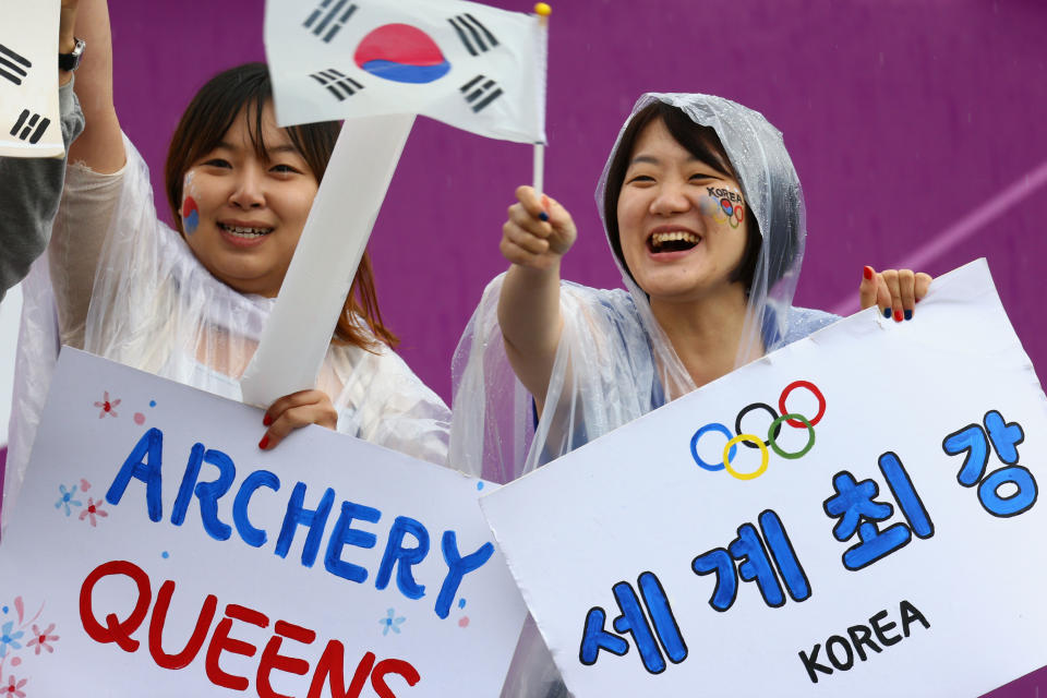 LONDON, ENGLAND - JULY 29: Lorea fans celebrate in the Women's Team Archery Semi Final between Korea and Japan on Day 2 of the London 2012 Olympic Games at Lord's Cricket Ground on July 29, 2012 in London, England. (Photo by Paul Gilham/Getty Images)