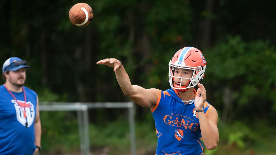 Millville's quarterback Jacob Zamot throws a pass during Millville High School's first football practice of the season held at Millville High School on Monday, August 7, 2023.  