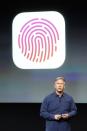 Phil Schiller, senior vice president of worldwide marketing for Apple Inc, talks about the new iPhone 5S Touch ID fingerprint recognition feature at Apple Inc's media event in Cupertino, California September 10, 2013. REUTERS/Stephen Lam (UNITED STATES - Tags: BUSINESS SCIENCE TECHNOLOGY BUSINESS TELECOMS)