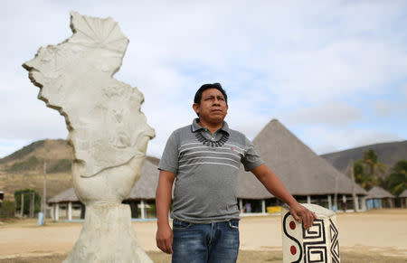 Chief Aldenir Lima, the leader of the 70 communities on the Raposa Serra do Sol reservation, poses for a photograph next to the monument made in honour of the tribes people and their struggle to secure their land rights, at the community of Maturuca on the reservation in Roraima state, Brazil February 12, 2019. REUTERS/Bruno Kelly