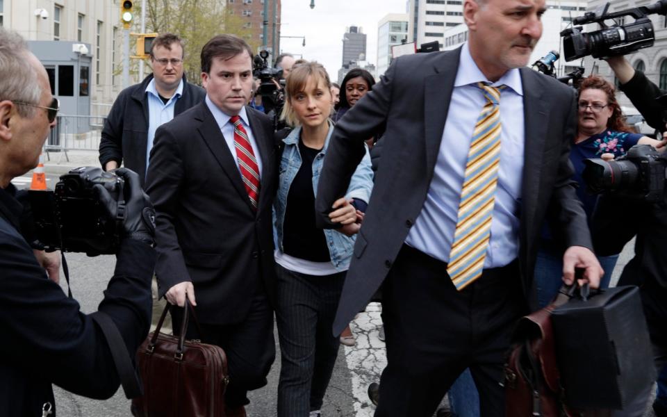 Allison Mack, the Smallville star, pleaded guilty to conspiracy and fraud - AP