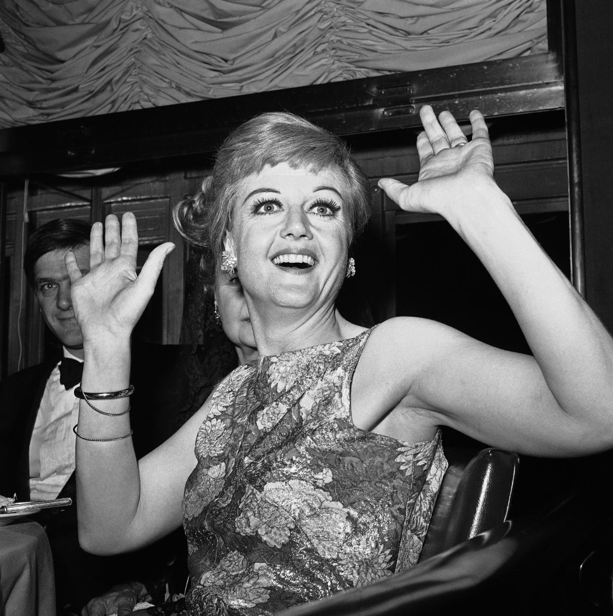 FILE - Angela Lansbury, the star of Broadway's newest musical "Mame," appears at a party following the opening of the show in New York, on May 24, 1966. Lansbury, the big-eyed, scene-stealing British actress who kicked up her heels in the Broadway musicals “Mame” and “Gypsy” and solved endless murders as crime novelist Jessica Fletcher in the long-running TV series “Murder, She Wrote,” died peacefully at her home in Los Angeles on Tuesday. She was 96. (AP Photo, File)