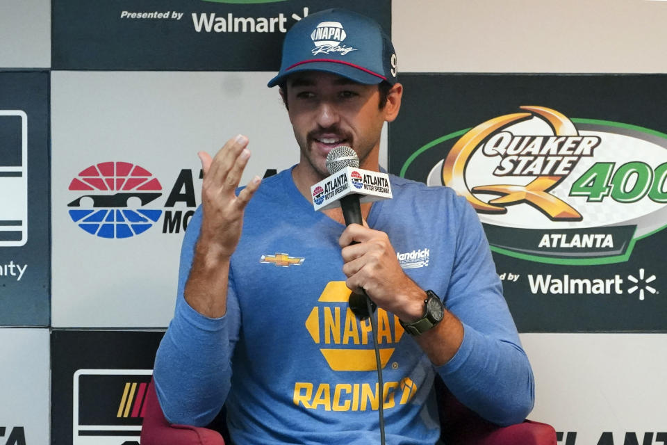 Driver Chase Elliott speaks to the media during a weather delay before qualifying the NASCAR Cup Series auto race at Atlanta Motor Speedway in Hampton, Ga., on Saturday, July 9, 2022. (AP Photo/Bob Andres)