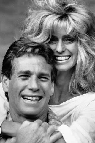 <p>Hulton-Deutsch Collection/CORBIS/Corbis via Getty</p> Ryan O'Neal and Farrah Fawcett