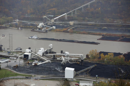 A coal barge moves past the at the Murray Energy Corporation port facility in Powhatan Point, Ohio, U.S., November 7, 2017. REUTERS/Joshua Roberts