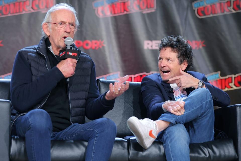 NEW YORK, NEW YORK - OCTOBER 08: Actors Christopher Lloyd (L) and Michael J. Fox attend a "Back To The Future Reunion" at New York Comic Con on October 08, 2022 in New York City. (Photo by Mike Coppola/Getty Images for ReedPop)