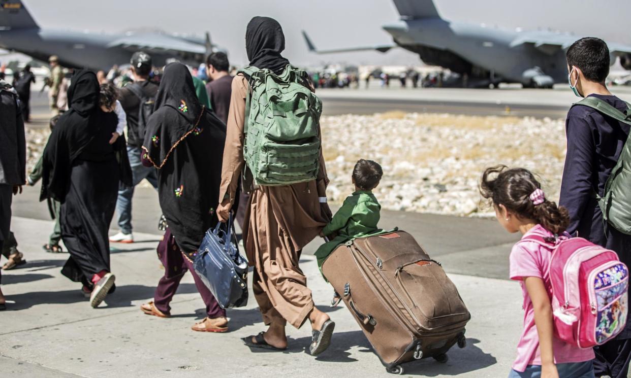 <span>Many families were separated when evacuating Kabul, as some people not able to board a flight fled to Pakistan. </span><span>Photograph: Sgt. Samuel Ruiz/AP</span>