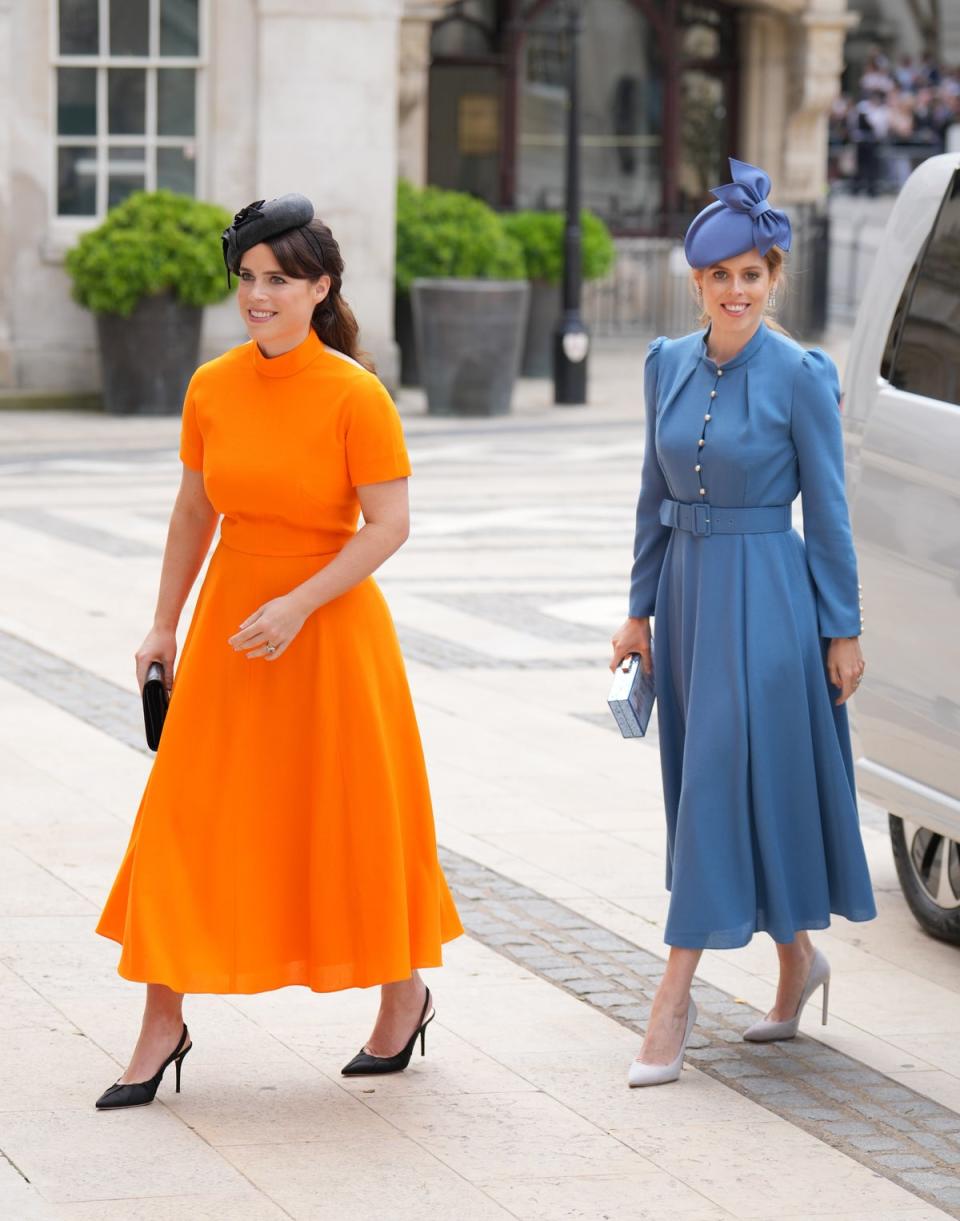 Princesses Beatrice and Eugenie wore bright blue and orange at the Platinum Jubilee (Victoria Jones/PA) (PA Wire)