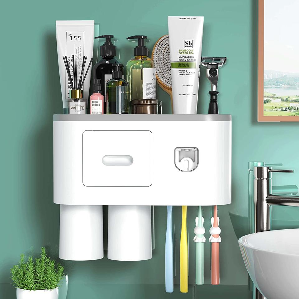 Toothbrush holder and toothpaste dispenser