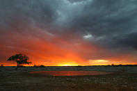 <p>A dramatic sunset at Okaukuejo in Etosha National Park with storm clouds moving in. (Photo: Gordon Donovan/Yahoo News) </p>