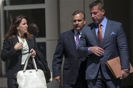 Diana Durand, ex-girlfriend and former fundraiser for Republican U.S. Representative Michael Grimm exits the Brooklyn Federal Courthouse with her lawyers in the Brooklyn Borough of New York May 5, 2014. REUTERS/Brendan McDermid