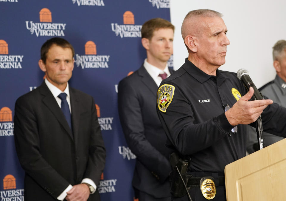 University of Virginia police chief Tim Longo, right, speaks to the media as University of Virginia President Jim Ryan, left, listens on Monday, Nov. 14, 2022 in Charlottesville. Va. Authorities say three students, all football players, were killed in a shooting on Sunday night. (AP Photo/Steve Helber)